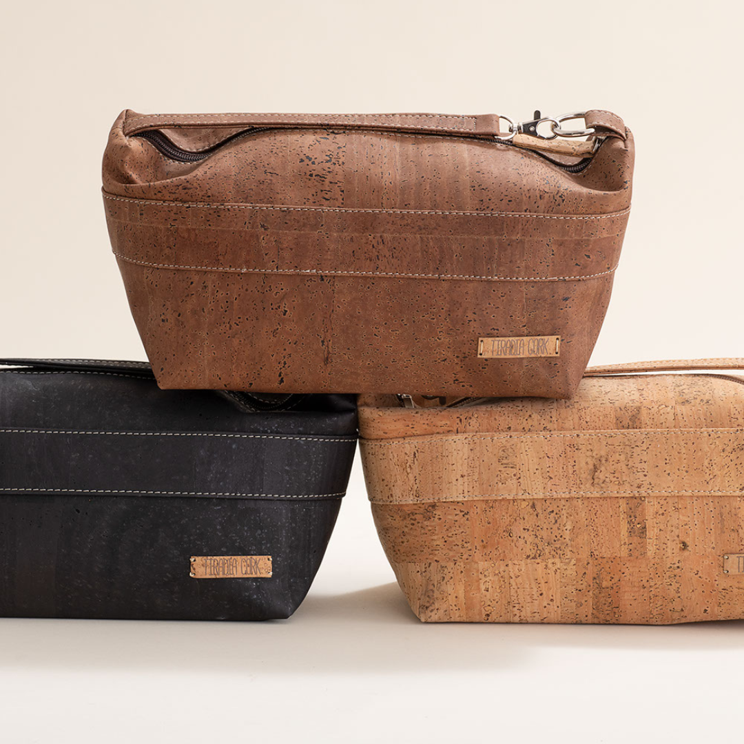 Three cork bags in brown, black, and beige on a light background