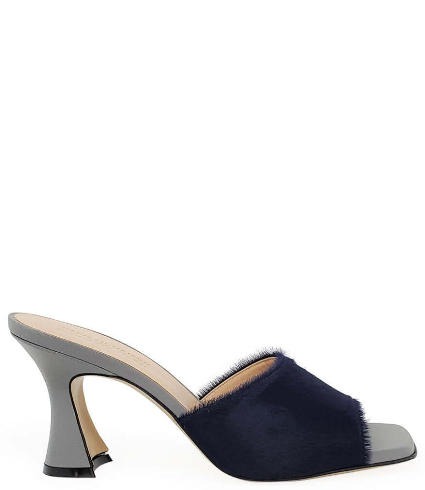 Navy blue sandal with a high heel on a white background