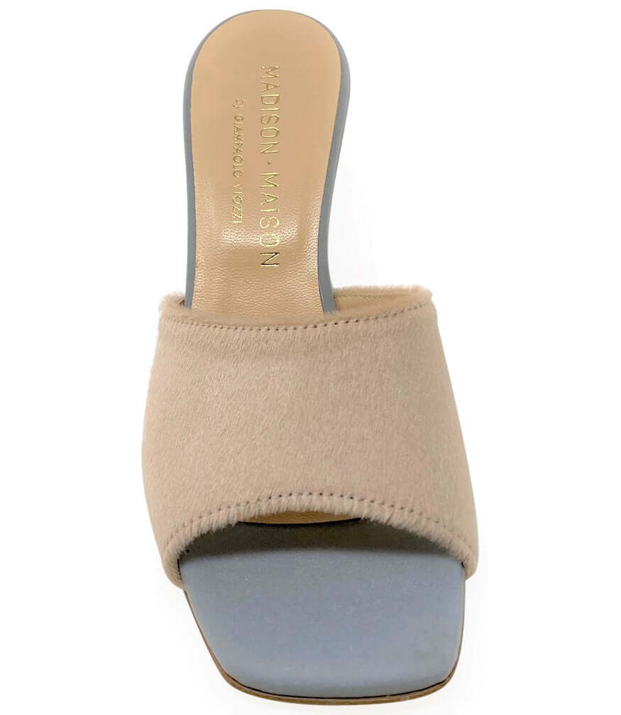 Beige sandal with a light blue sole on a white background