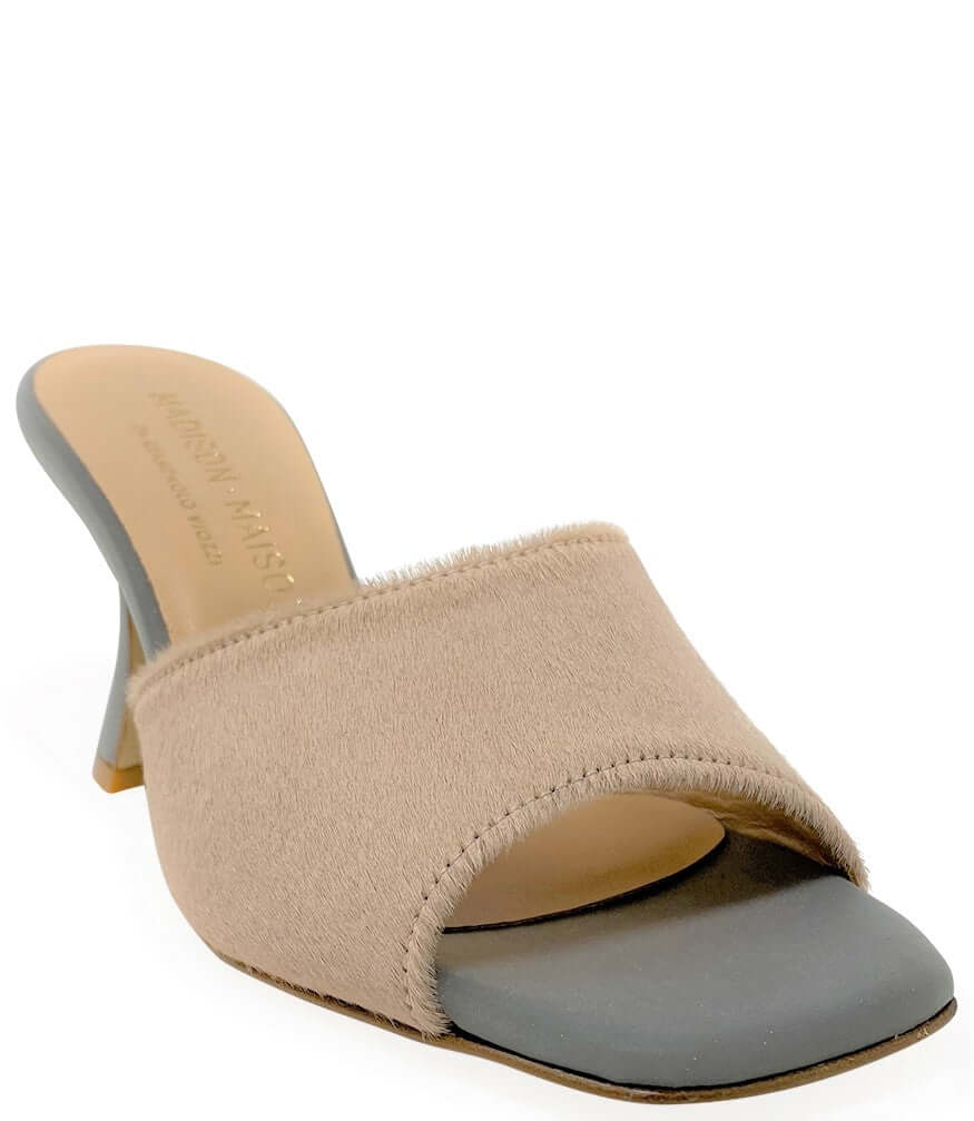 Beige sandal with gray sole on a white background