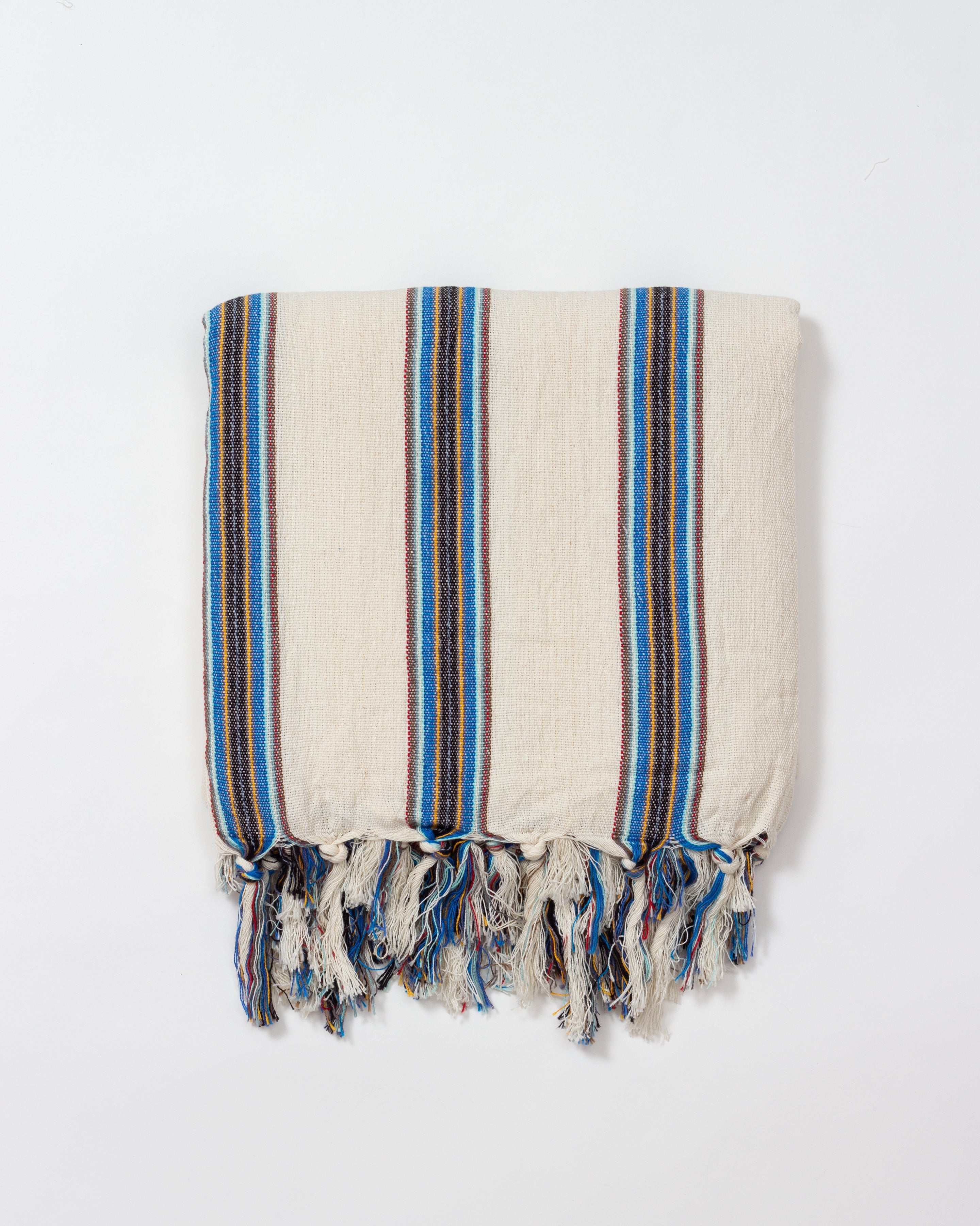 Beige towel with blue and brown stripes on a white background