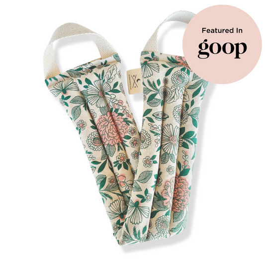 Floral-patterned product with 'goop' branding on a white background