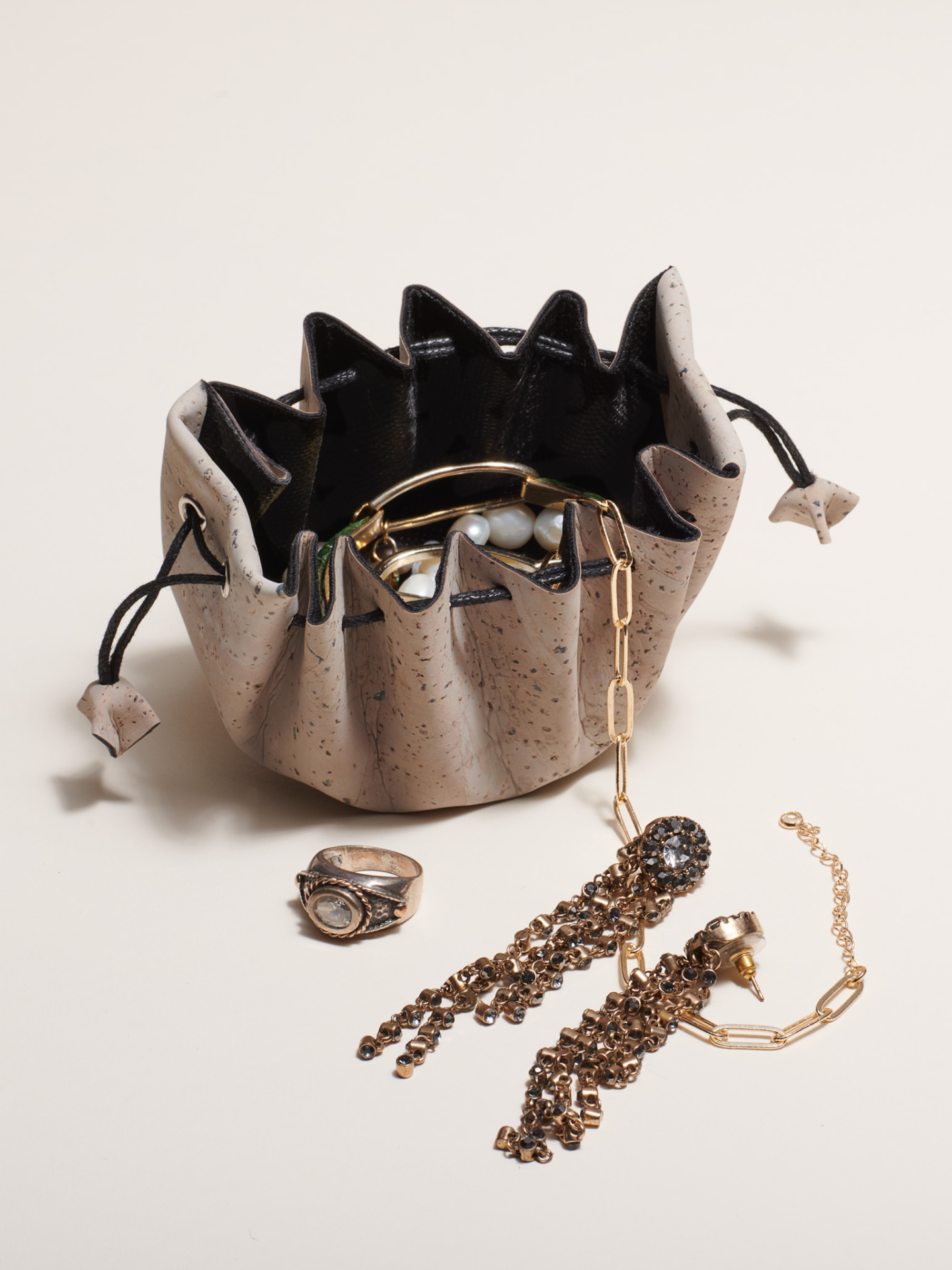 Jewelry organizer with jewelry on a light background