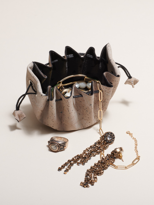 Jewelry organizer with jewelry on a light background