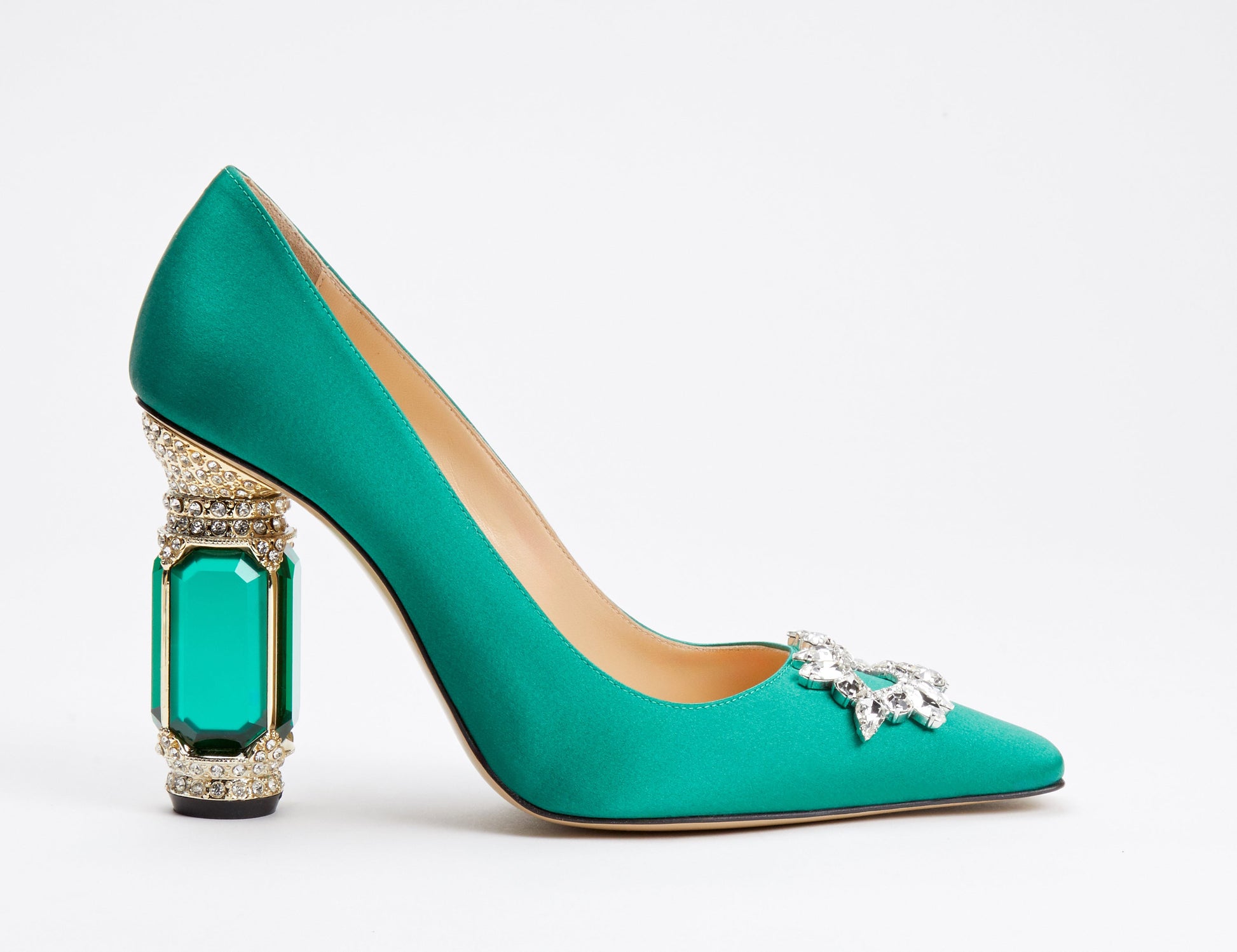 Turquoise high-heeled shoe with decorative heel and embellishments on a white background