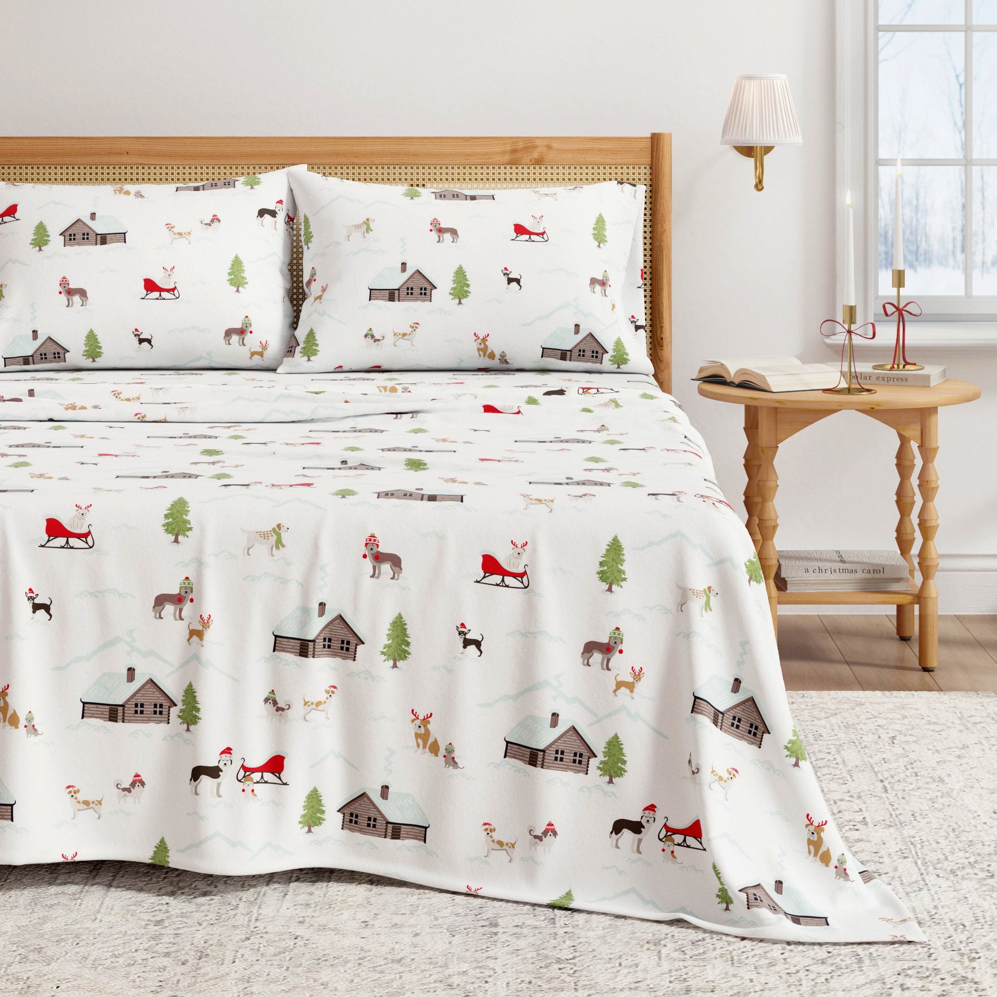 Bed with festive patterned bedding featuring Christmas elements in a room setting.