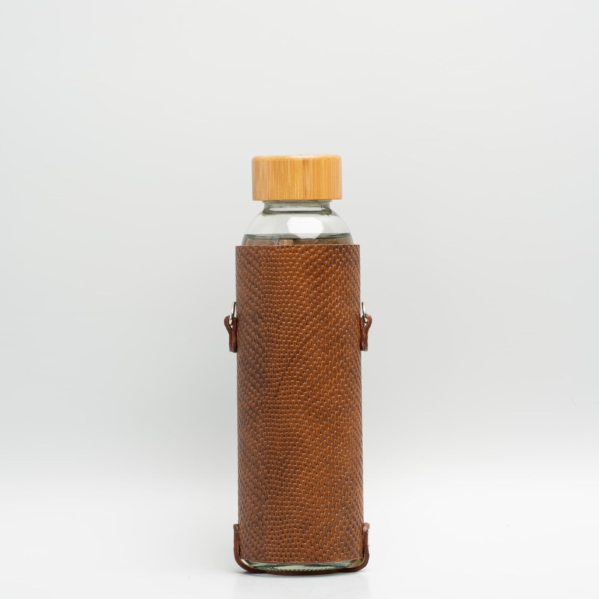 Leather water bottle holder with strap and glass bottle - The Peony Haus